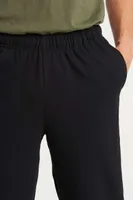 Pantaloni unisex Just Hoods College Cuffed Jogpants personalizați, pe model