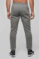 Pantaloni unisex Proact Adult Multisport Jogging Pants With Pockets personalizați, pe model