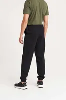 Pantaloni unisex Just Hoods College Cuffed Jogpants personalizați, pe model
