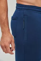 Pantaloni unisex Proact Adult Multisport Jogging Pants With Pockets personalizați, pe model