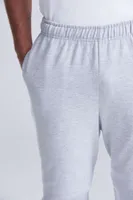 Pantaloni unisex Just Hoods College Cuffed Jogpants personalizați, pe model