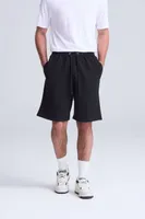Pantaloni scurți unisex Just Hoods Campus Shorts personalizați, pe model